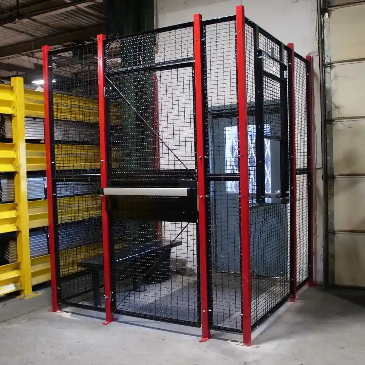Wire mesh partition security cage in warehouse